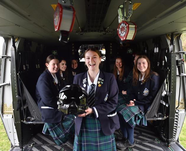 Holding an Air Force helmet in a NH90 military helicopter is Otago Girls’ High School pupil Grace...
