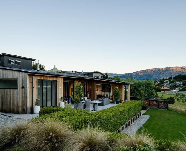 This Wanaka house overlooks the Mount Aspiring College playing fields, giving views of the...
