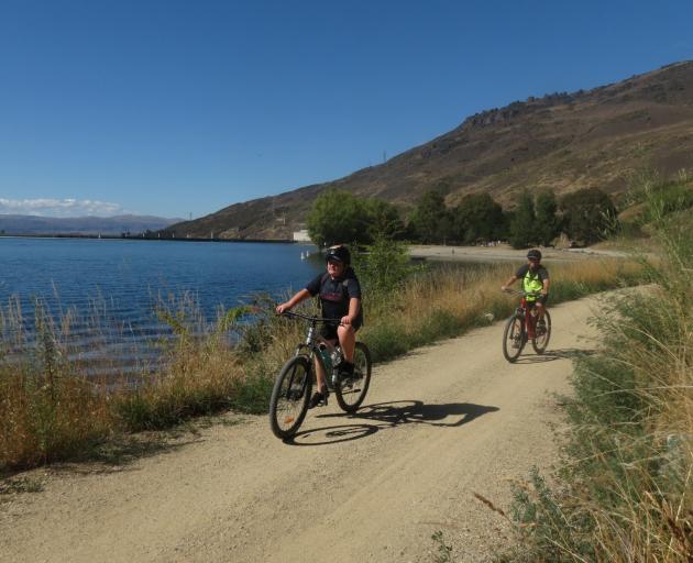 Taine Ballantyne (12), from Alexandra, and his uncle, Lindsay Warburton, from Cromwell, cycle the...