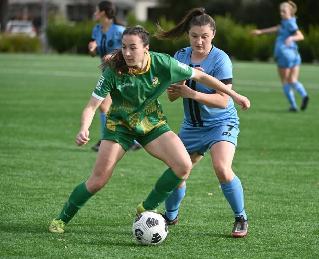 Green Island’s Kate Johnstone (left) shields the ball from Dunedin City Royals player Mya...