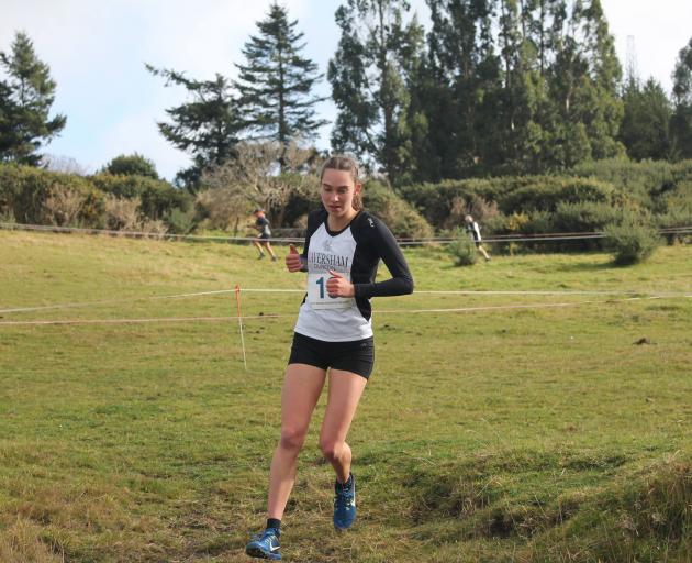 Becky De La Harpe runs the second 2km leg for the Caversham women’s team during the Leith cross...