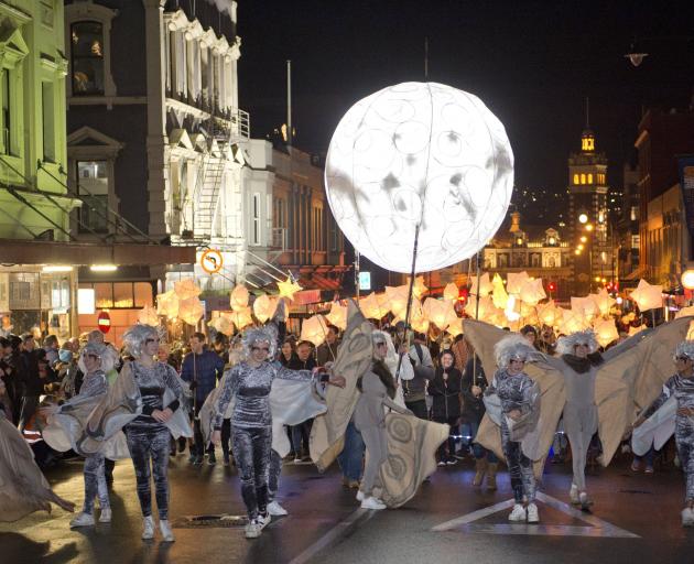 The Dunedin Midwinter Carnival procession approaches the Octagon from lower Stuart St last June....