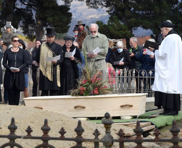 Mourners, including (from left) Dr Peter Petchey, Prof Hallie Buckley (both from the University...