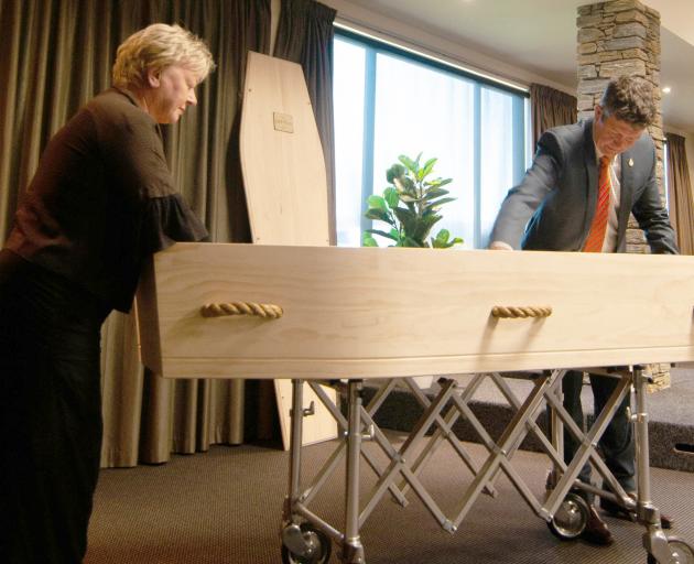 Affinity Funerals funeral directors Lynley Claridge and Gary Wybrow work on final preparations...