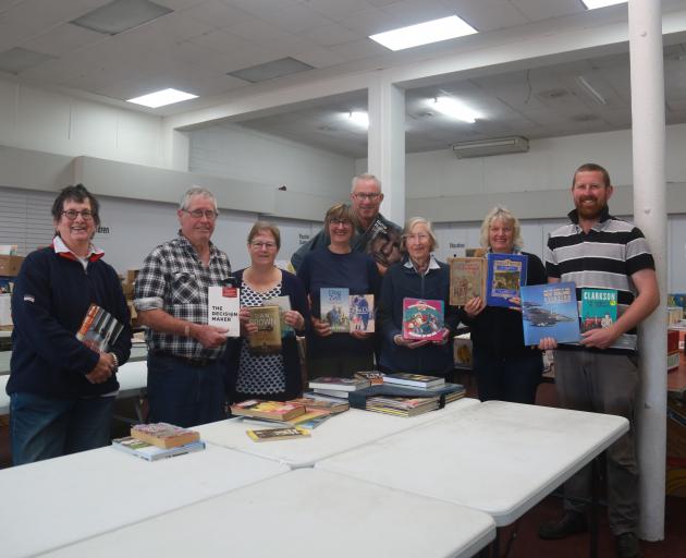 Sorting through books for this year’s Bookarama are (from left) Jacquie Webby, Stewart Anderson,...