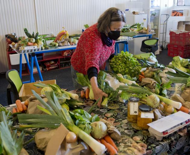 Rose Newburn packs a box of fresh produce at the Locavore workshop. PHOTO: GERARD O’BRIEN