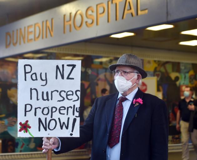 Protester Jim Moffat, of Dunedin, demands more pay for nurses outside Dunedin Hospital this week....