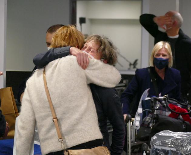 Helen Turnbull, of Sydney, hugs her sister, Fiona Turnbull, of Dunedin, at Queenstown Airport...