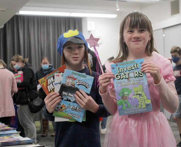 Carter Price (7) and Ava Oakley-Samons (4) were given a comic book by Greenlight Innovations...
