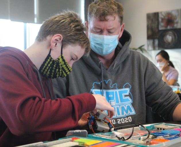 Luke Biggar (13) built his robot with the help of dad John.