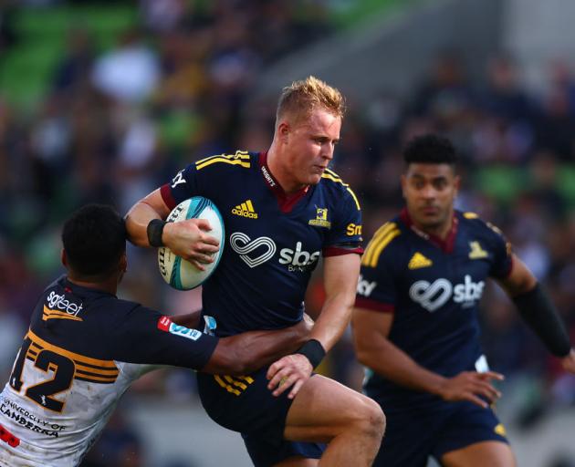 Sam Gilbert of the Highlanders is tackled during the round 10 Super Rugby Pacific match against the Brumbies. Photo: Getty Images