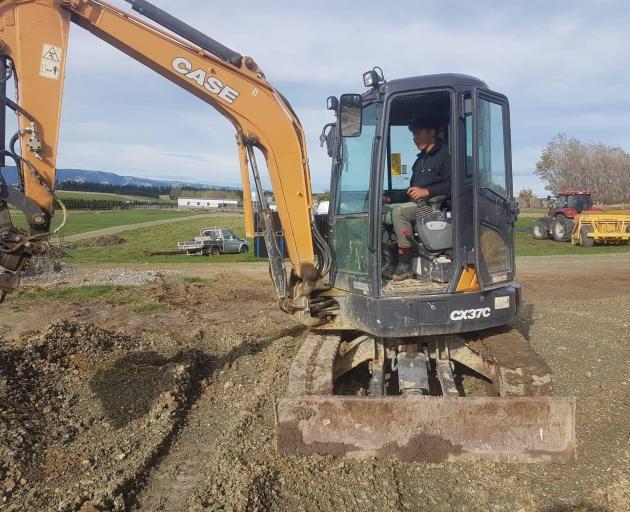 Papakura High School pupil Pounamu Henare-Arona (17) operates a digger in West Otago. PHOTOS:...
