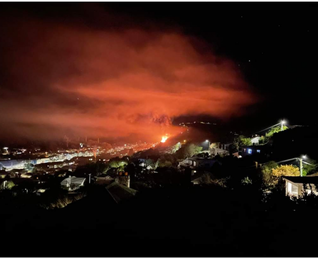 A house fire lit up North East Valley last night. Photo: LAURA HUDSON