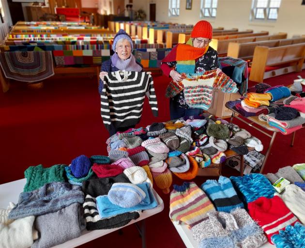 Ina Avis, left, and Ros Stewart at St Stephen's church with some of the knitting ready to be sent...