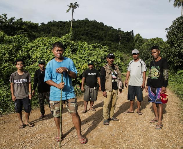 PNNI para-enforcer leader Tata Balladares, third left, and his team of land defenders.