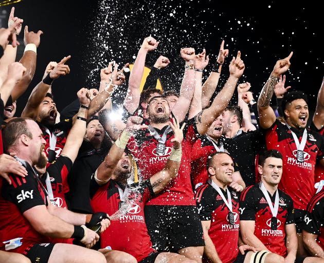 The all-conquering Crusaders celebrate their sixth title in six years. Photo: Getty Images