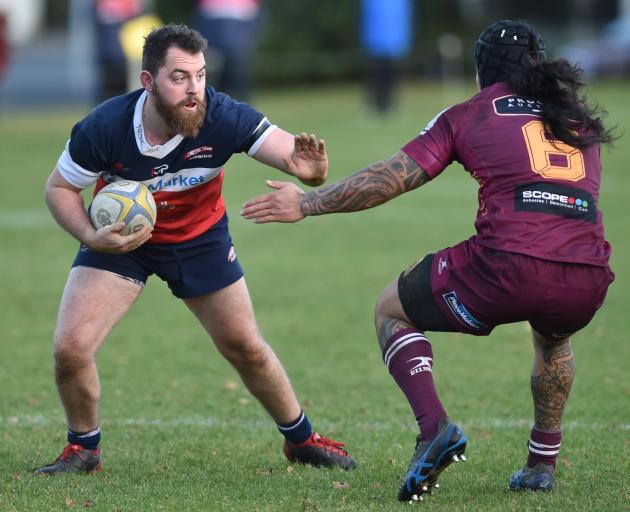 Harbour flanker Mitch Regan prepares to fend off Alhambra-Union No8 Tyron Pelasio at the North...