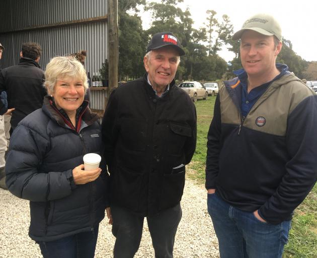 Jenny Chisnall (left), of Amberley, and James Hoban (right), of Waikari, chat with Bruce Johns at...