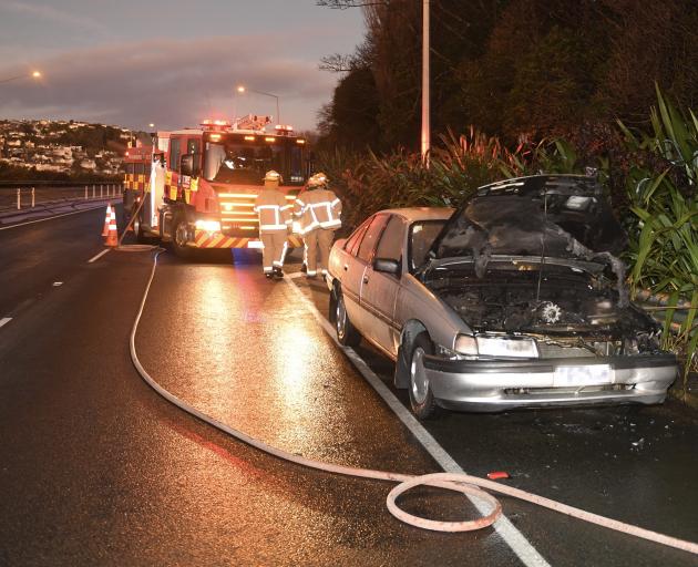 A car skidded on ice damaged the Southern Motorway median barrier before catching fire at about 7...