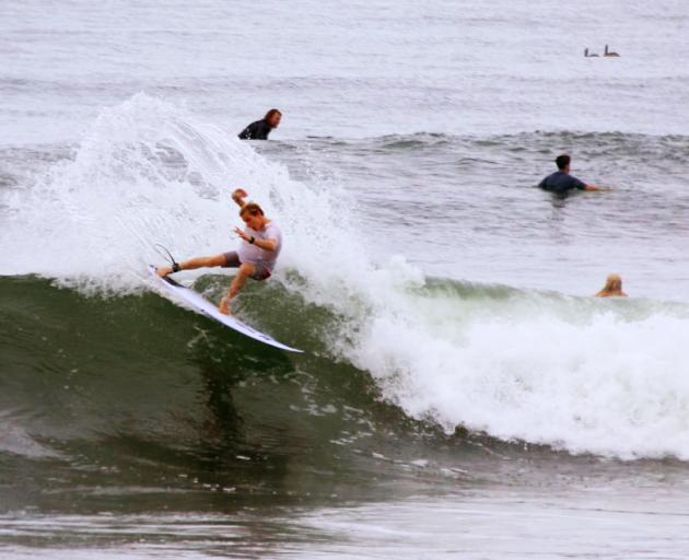 Sumner’s Jack Tyro masters a wave at the world junior surfing championships in El Salvador. Photo...