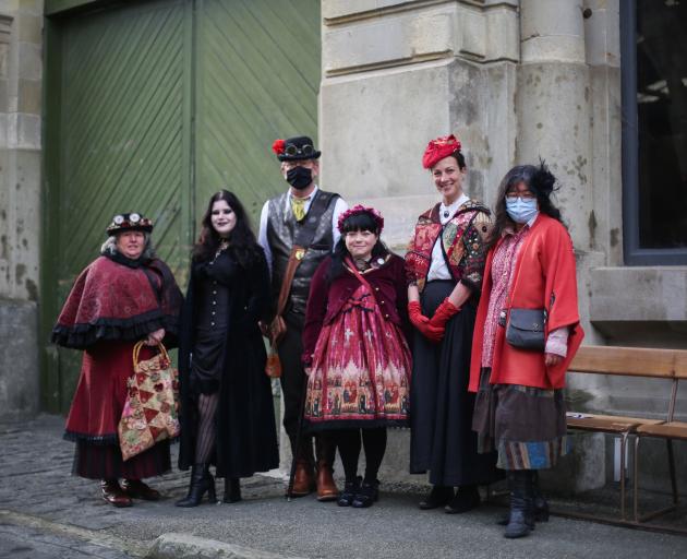 Dressing up for the Winter Warm Up events in Oamaru’s Harbour St yesterday are (from left) Clare,...
