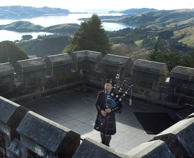 Sally Craik plays on the Larnach Castle tower along with other pipers throughout the Commonwealth...