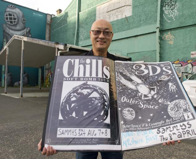 Former owner Sam Chin outside Sammy’s with posters from the Chills and 3Ds gigs. PHOTO: GERARD O...