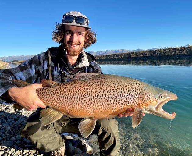 Angler Scott Miller with a 9kg brown trout he landed in the Tekapo canal in April.