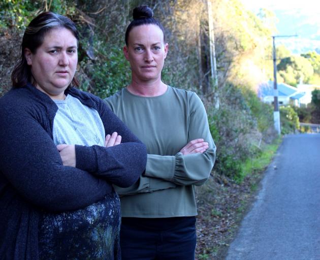 Treetop Dr residents Charlotte Meyer (left) and Amanda Mclean say the lack of a footpath in part...