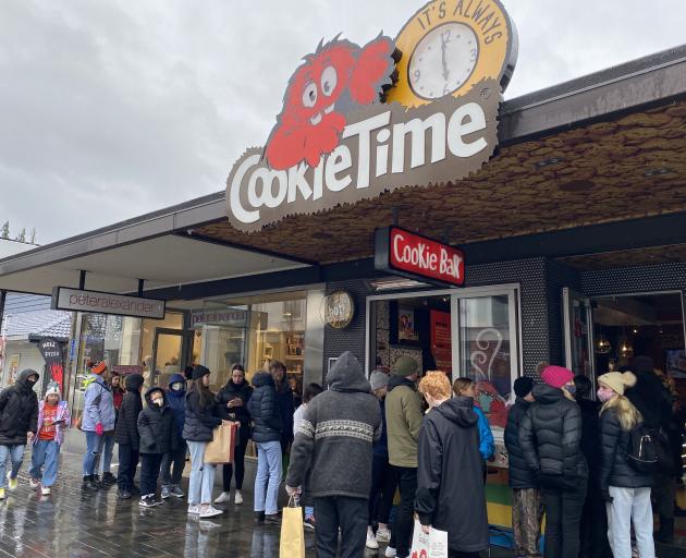 Customers queue outside Queenstown’s Camp St Cookie Time store yesterday afternoon. PHOTO: LUCY...