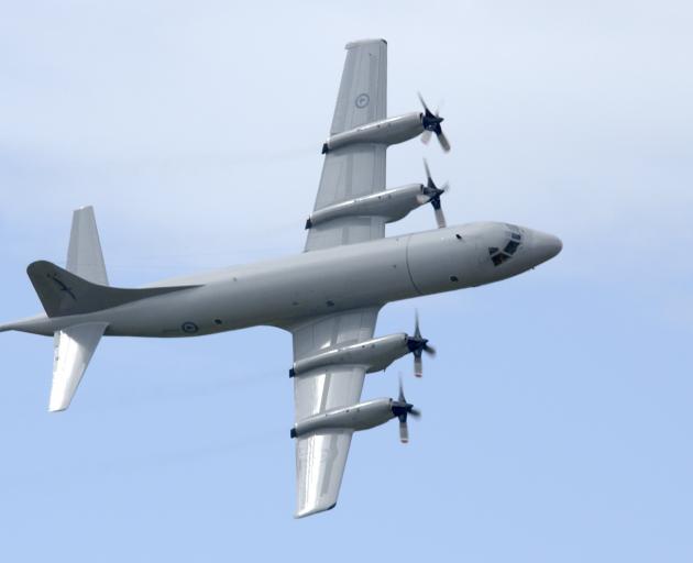 A Royal New Zealand Air Force Orion performs a fly-past over Whenuapai air base, where it has...