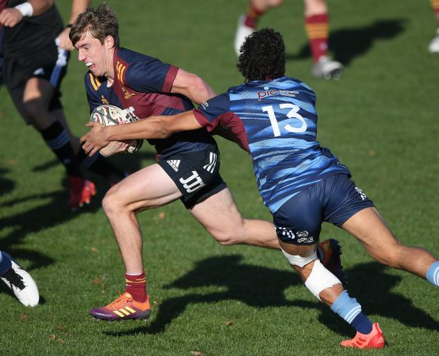 Highlanders first five Cameron Millar (left) in action at the national under-20 tournament in May...