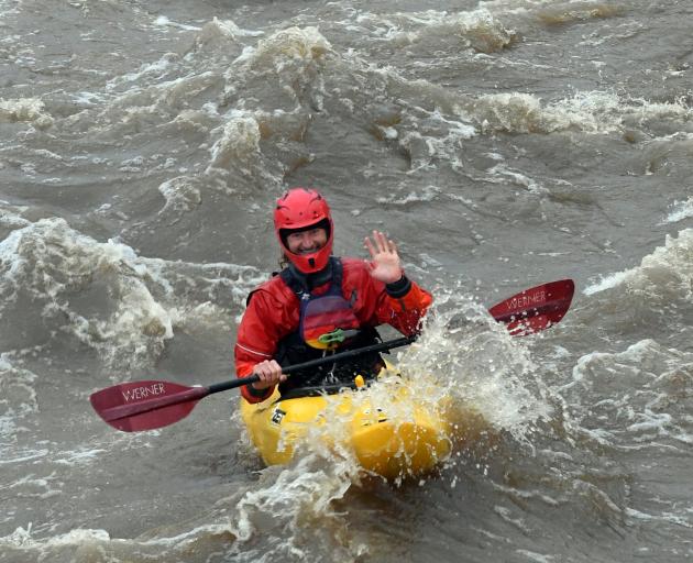 Kayaker Jonathan Falconer takes on the flooded Water of Leith yesterday. PHOTO: STEPHEN JAQUIERY
