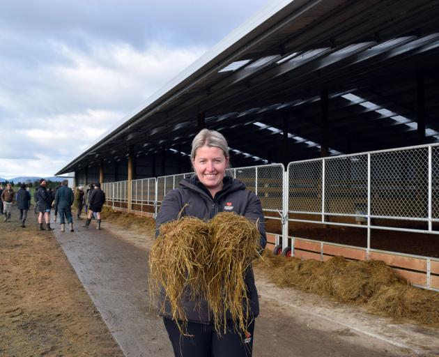Top Deck Trading farm manager Kate Roberts shows the grass baleage she feeds to stags in a winter...