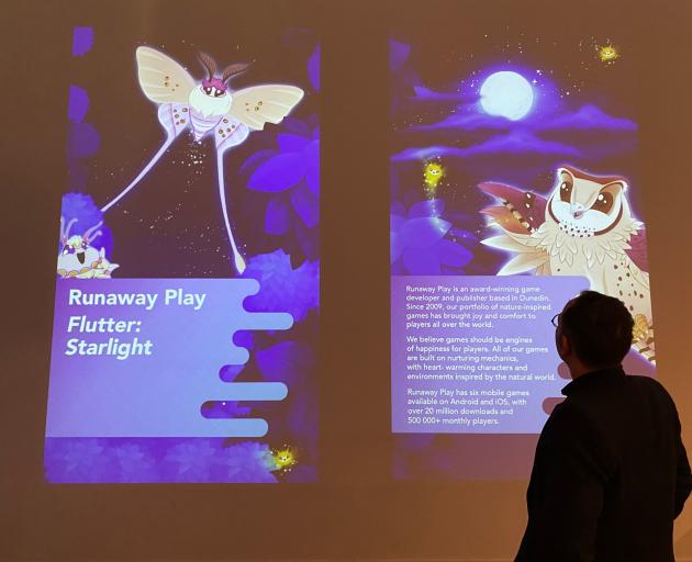 Otago Museum staff member Gareth West is pictured with Runaway Play’s game Flutter: Starlight,...
