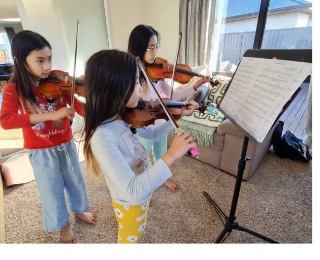 Dunedin sisters (from left) Tiffany (9), Isabelle (7), and Olivia Mei (10), all pupils of Ella...