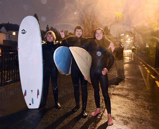 Out of the water after a surf down the Water of Leith last evening are (from left) Riley Green ...