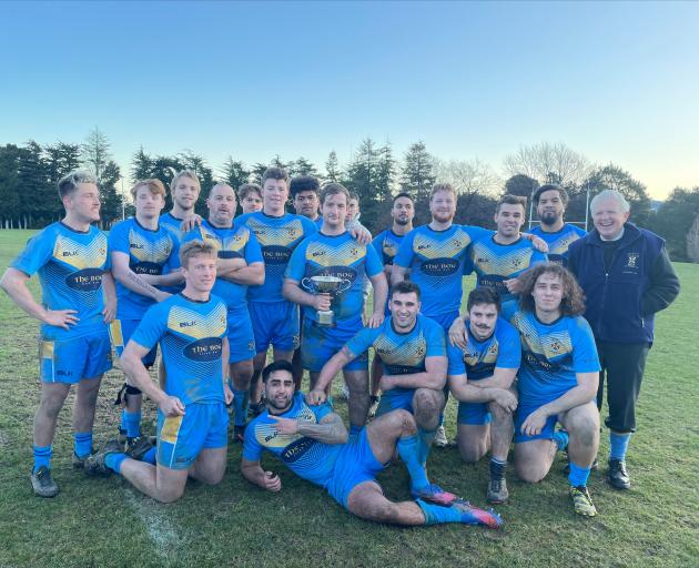 Otago University rugby league players and former representative Alex Familton celebrate getting...