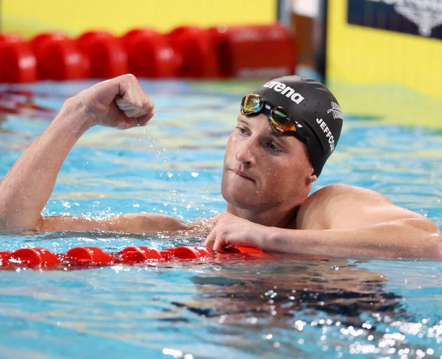 Andrew Jeffcoat celebrates his win in the 50m backstroke final. Photo: Reuters