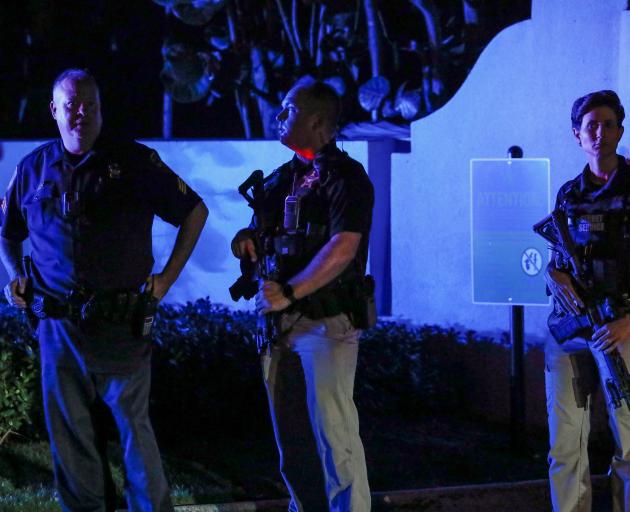 Secret service members stand guard outside Donald Trump's Mar-a-Lago home after Trump said that...