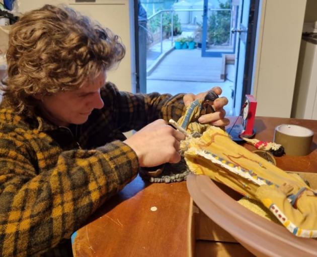 Thomas Gilchrist, a regular volunteer at the Repair Revolution meetings, tries to repair a broken...