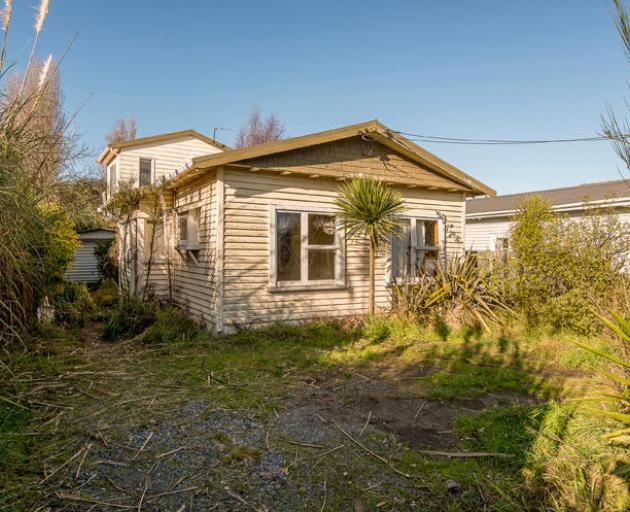 A two-bedroom bungalow on Sinclair St in New Brighton, Christchurch, was sold “as is, where is”....