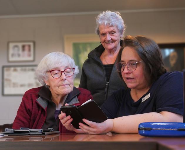 Clutha libraries digital programmes co-ordinator Dalene Breytenbach guides Lawrence residents...