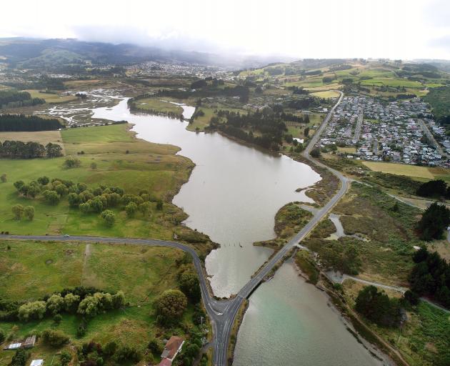 The Kaikorai estuary flows out to sea past Waldronville (right) and under Brighton Rd. PHOTO:...