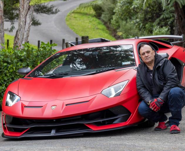 Mark Lipsham, $19m Lotto winner, with his $880,000 Lamborghini. Photo: NZ Herald