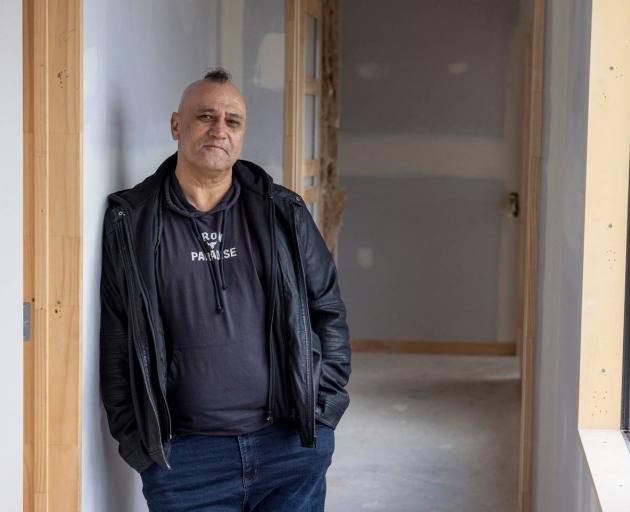 Lotto winner Mark Lipsham inside his new, unfinished, home in Riverhead. Photo: NZ Herald