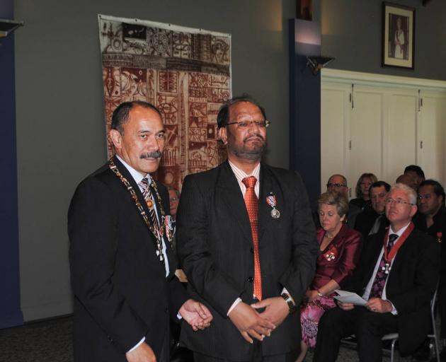 Former Governor General Sir Jerry Mataparae with Davinder Singh Rahal (right) as he receives the...
