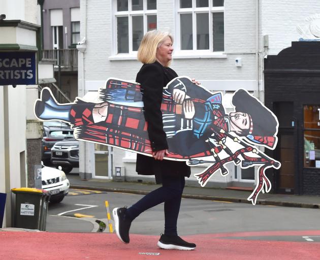 Scottish Shop owner Sharon Hannaford takes items to the shop’s new premises in lower Stuart St....