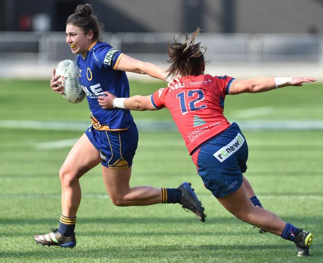 Otago Spirit's Sheree Hume fends off Jaimie Page from Tasman Mako before scoring a try at Forsyth...
