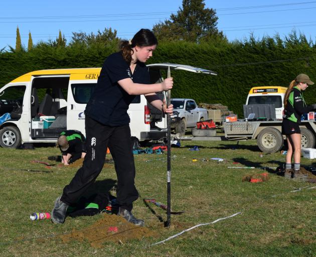 Geraldine High School pupil Charlotte McNamee (15), of Geraldine, loosens soil with a crowbar.